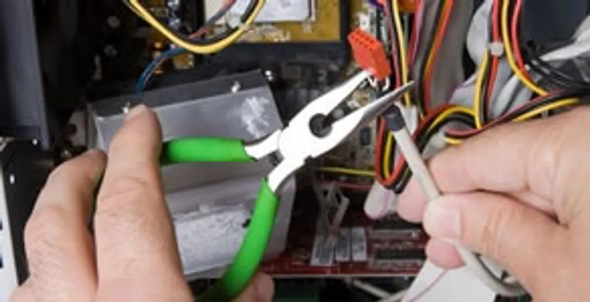 Licensed electrical contractor performing electrical repair with tools in Circle Pines, MN